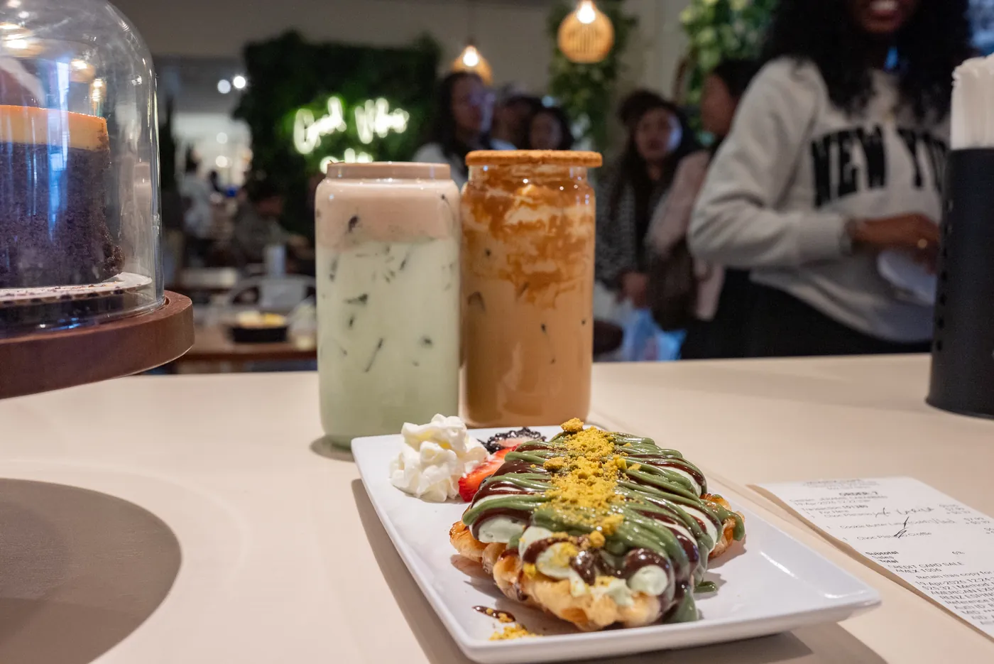Pistachio waffle with syrup and crushed nuts